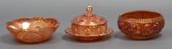 Picture of A set of two Carnival glass bowls and a butter disc