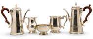 Picture of A pair of silver coffee pots and matching cream jug and sugar bowl