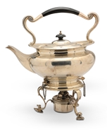 Picture of A silver tea kettle with stand and burner