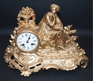 Picture of AN ENGLISH BRONZE GILDED CLOCK WITH A LADY