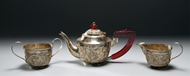 Picture of A presentation three - piece Indian silver tea